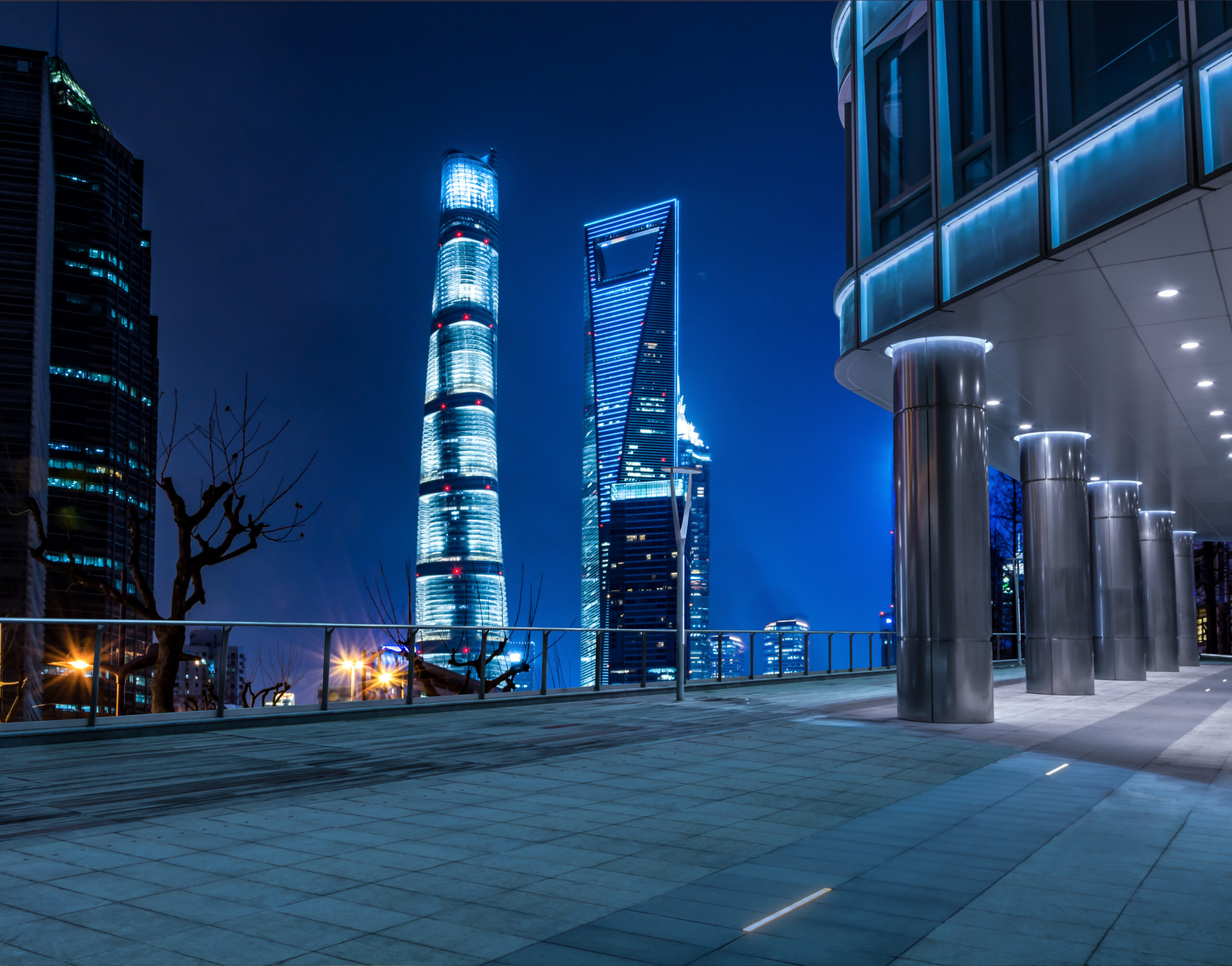 empty floor with modern skyline and buildings at night in shangh